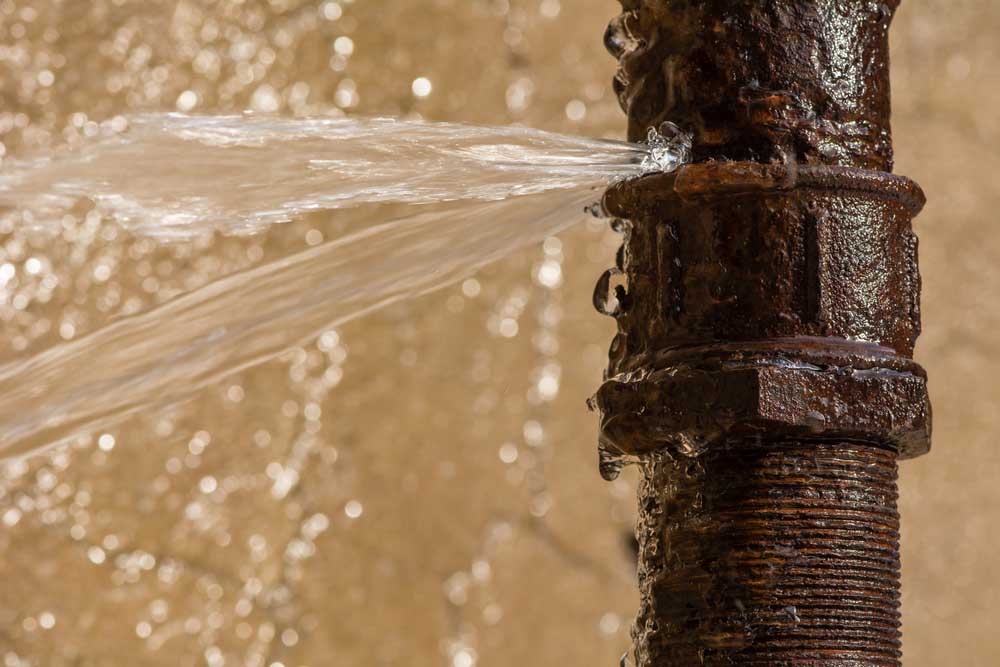 a damaged pipe with a water leak or flooding